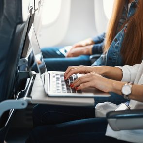 Close Up Photo Of Aircraft Passenger With Gadget