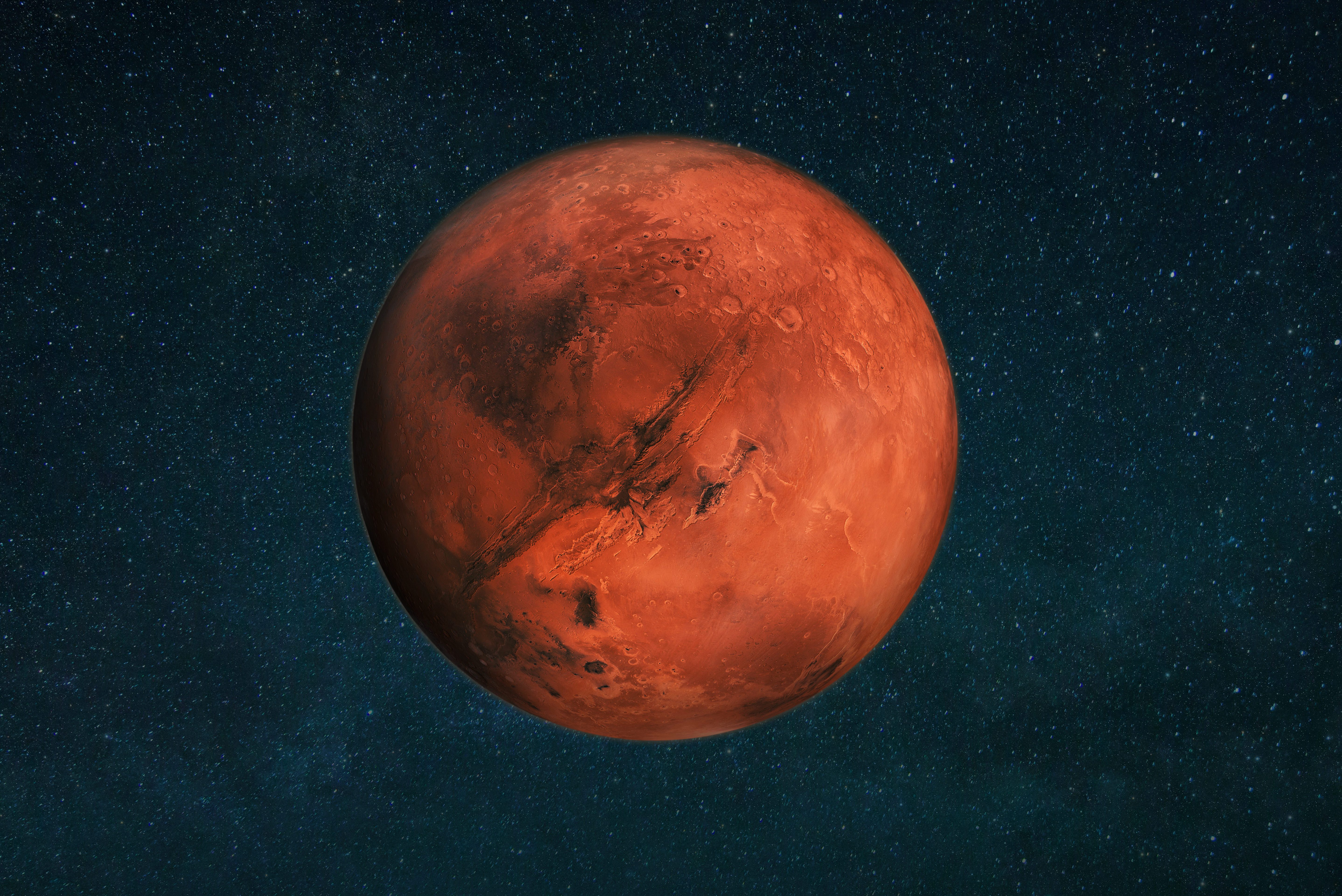 Planet Mars in the starry sky. Red planet in space