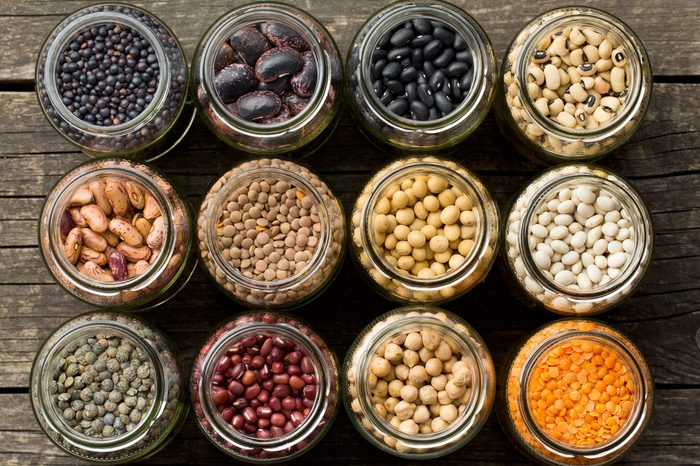 top view of various dried legumes in jars