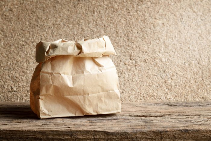 brown paper bag on wooden background