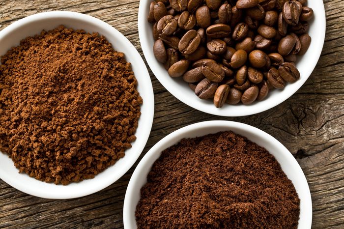 coffee beans, ground coffee and instant coffee in three bowls