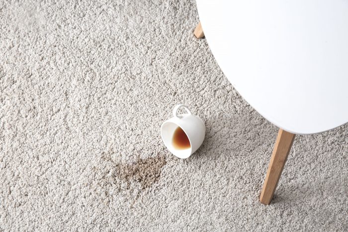 Cup of coffee spilled on carpet