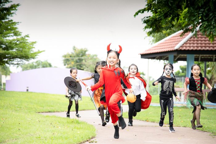 Young kids trick or treating during Halloween
