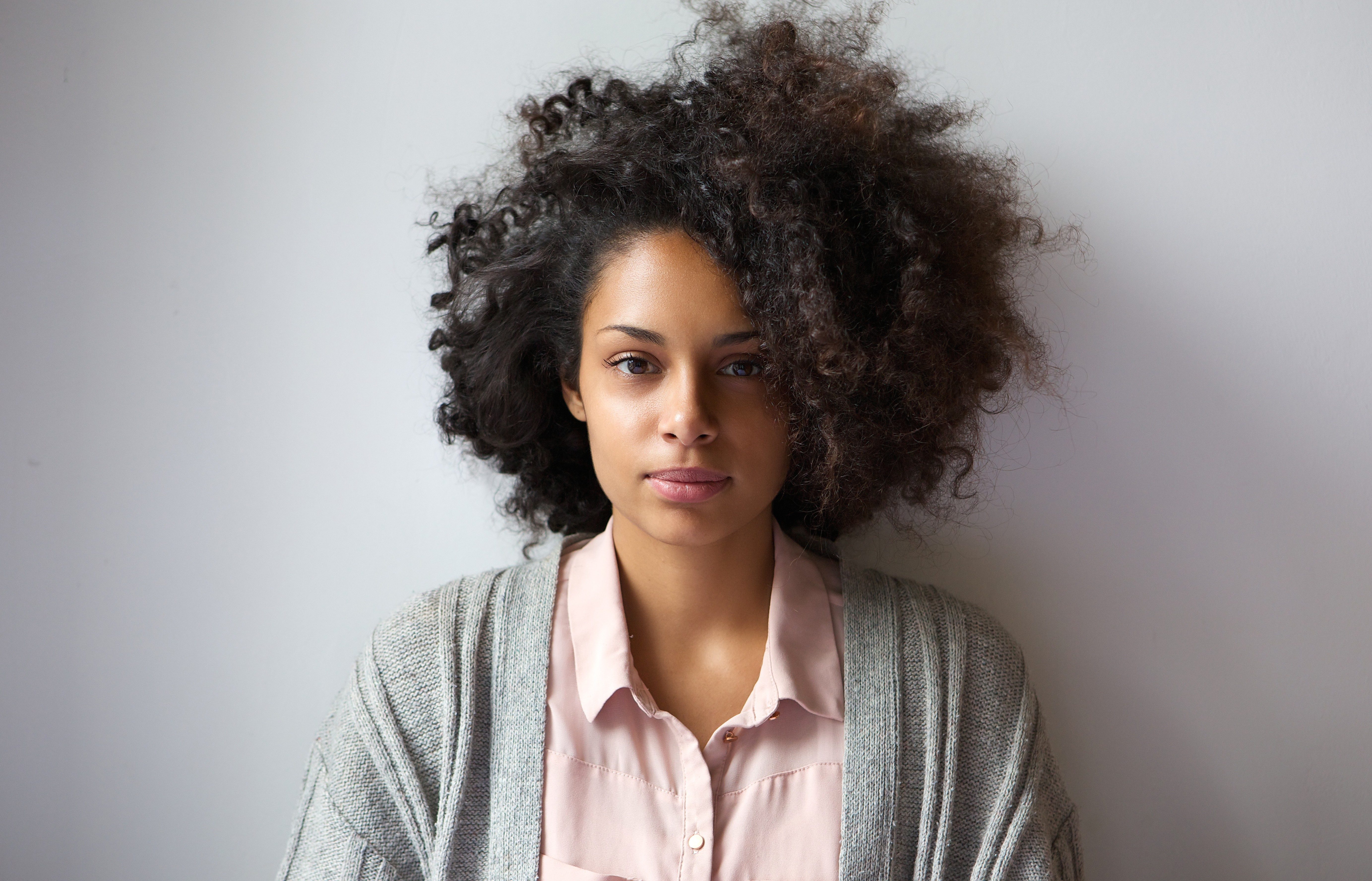 Close up portrait of a beautiful young woman with afro hairstyle