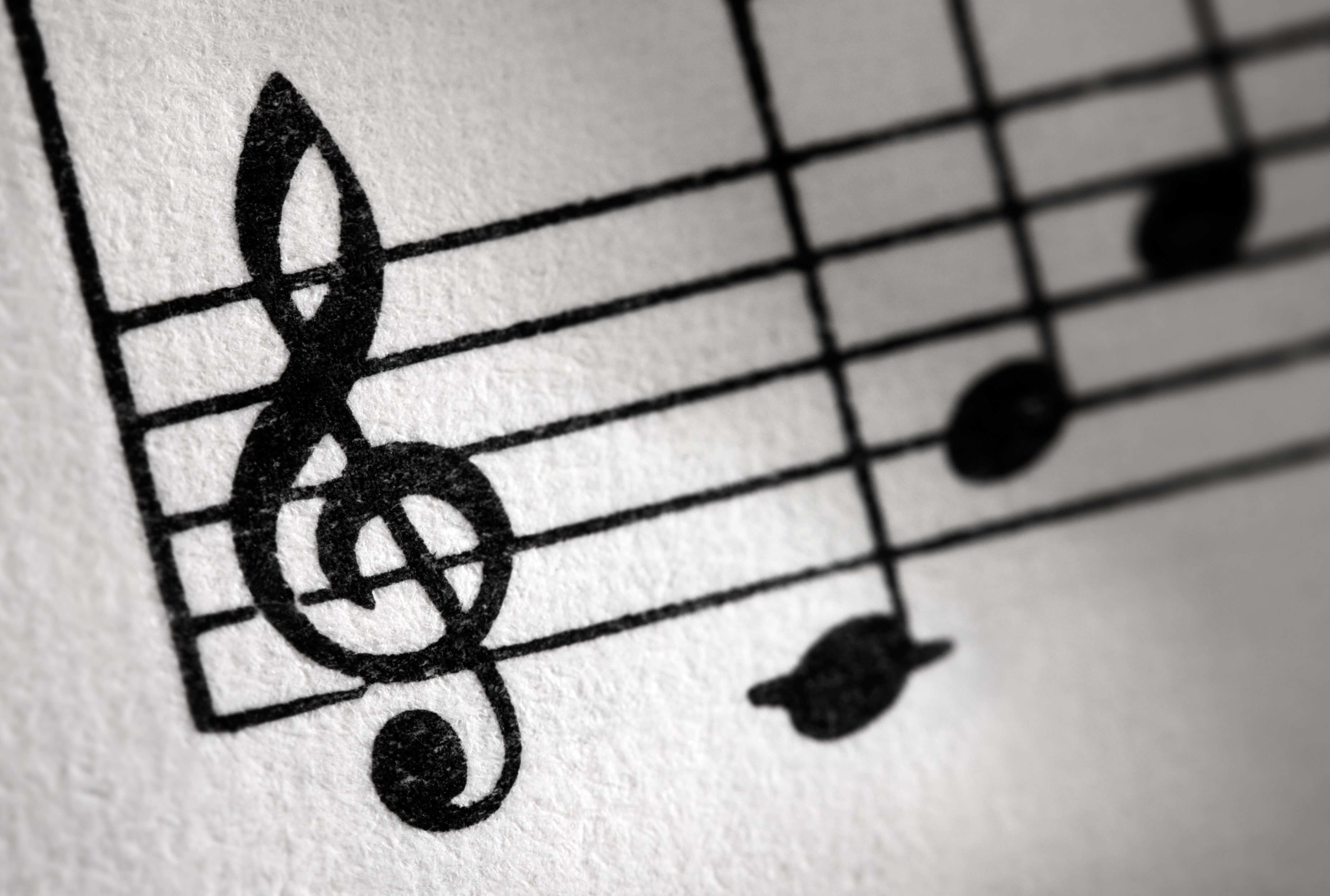 Treble clef and music sheet, diagonal image formation.