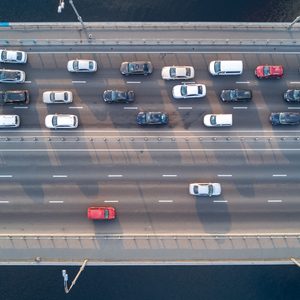 Aerial top view of bridge road automobile traffic of many cars, transportation concept