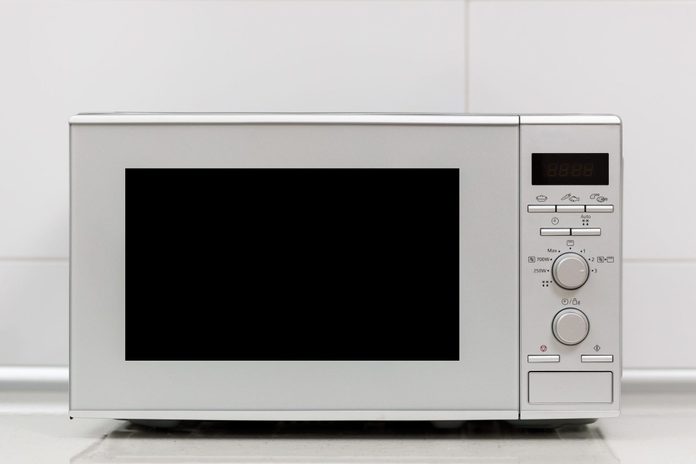 Modern kitchen interior. Kitchen interior with gas stove and microwave oven close up