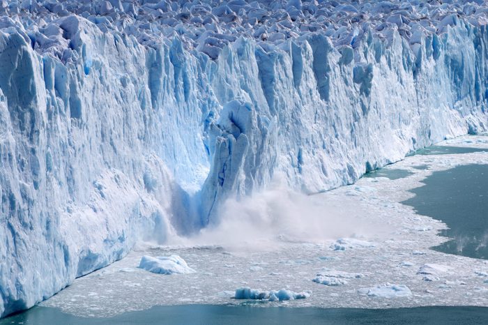 Glacial ice calving with massive ice blacks crashing into the water - 2018