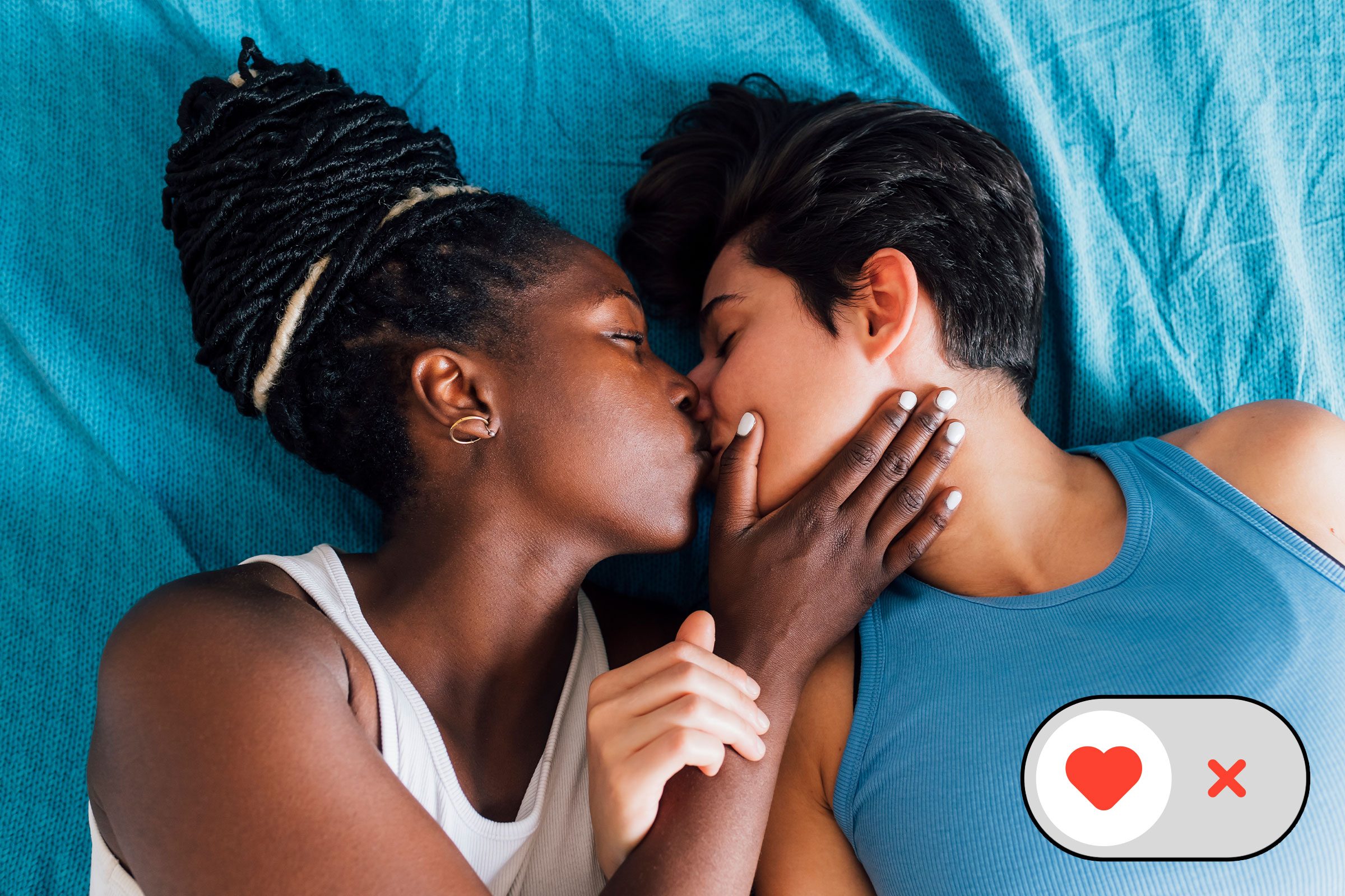 two women in bed kissing