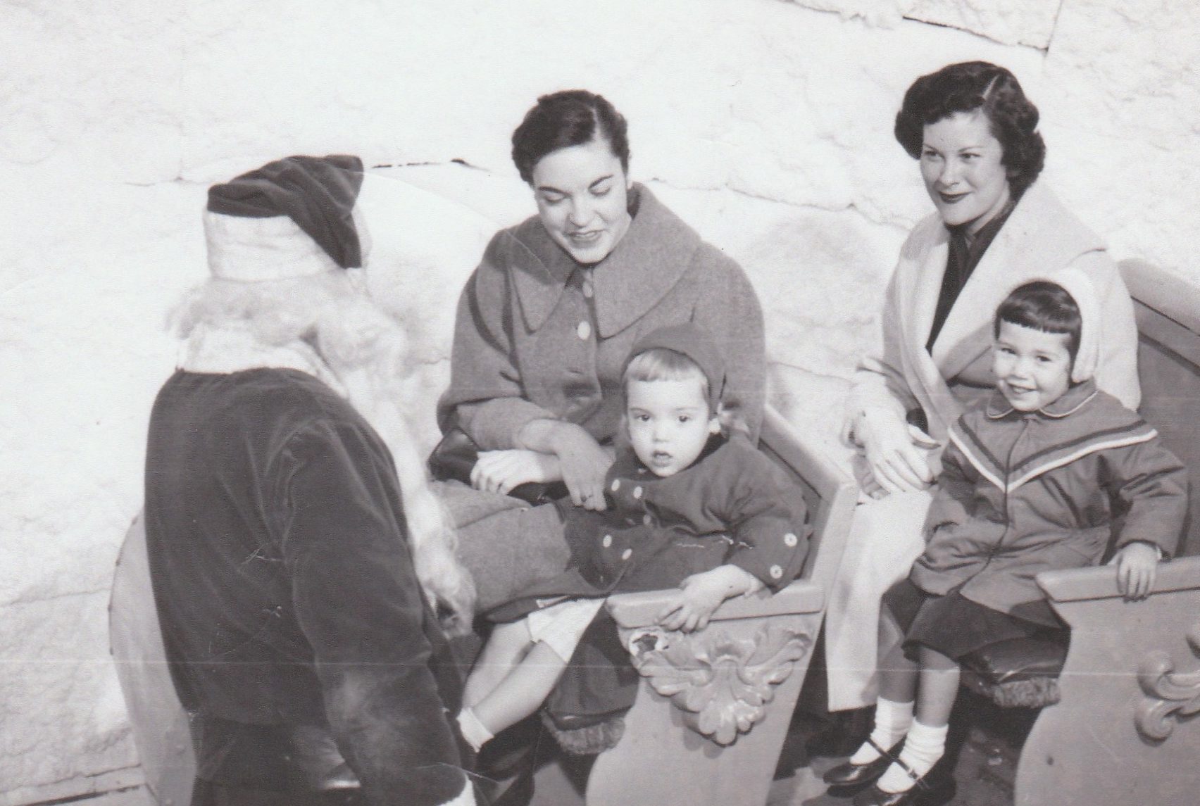 This picture of me; my mom; my aunt Doris and my cousin Johnnie. My mom and me are on the right. Doris is mom's sister and we were at Hudson's in downtown Detroit visiting Santa. The year of picture late 1950's or early 1960's as I was born in 1954.