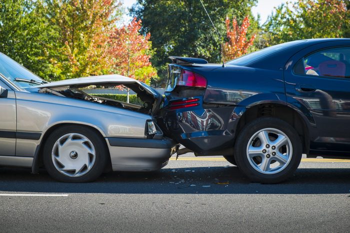 Auto accident involving two cars on a city street