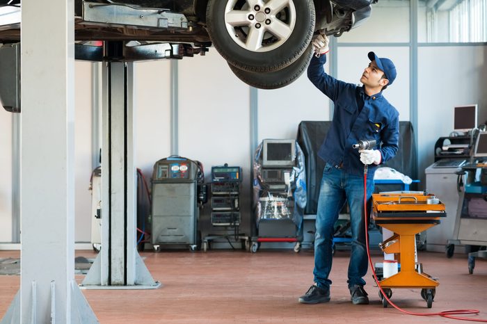 Portrait of a mechanic at work in his garage