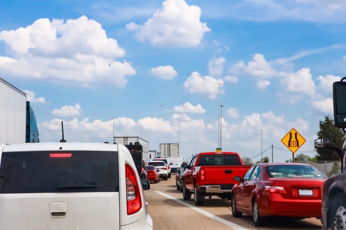 Traffic and highway signs on the highway on a summer day