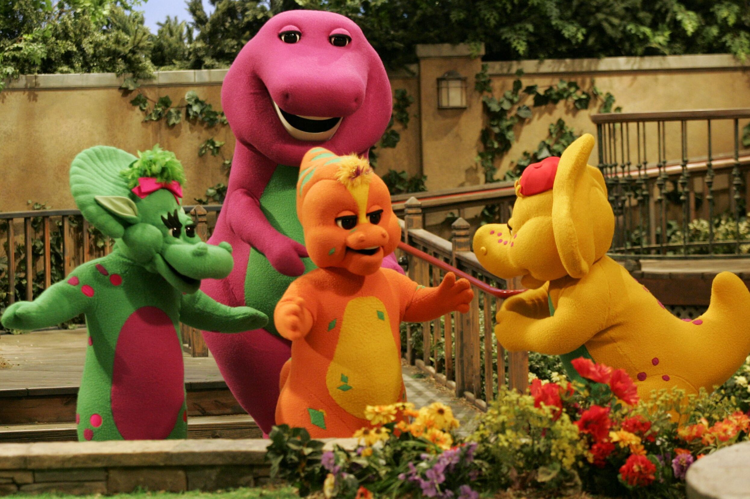 Mandatory Credit: Photo by Donna Mcwilliam/AP/Shutterstock (6376107a) Barney and Friends Riff, front, center, a new character on the Barney & Friends show, is shown with with the show's other dinosaur characters, Baby Bop, left, Barney, back, and B.J., right, during the taping of a new Barney episode at the Barney & Friends studio in Carrollton, Texas BARNEY AND FRIENDS, CARROLLTON, USA