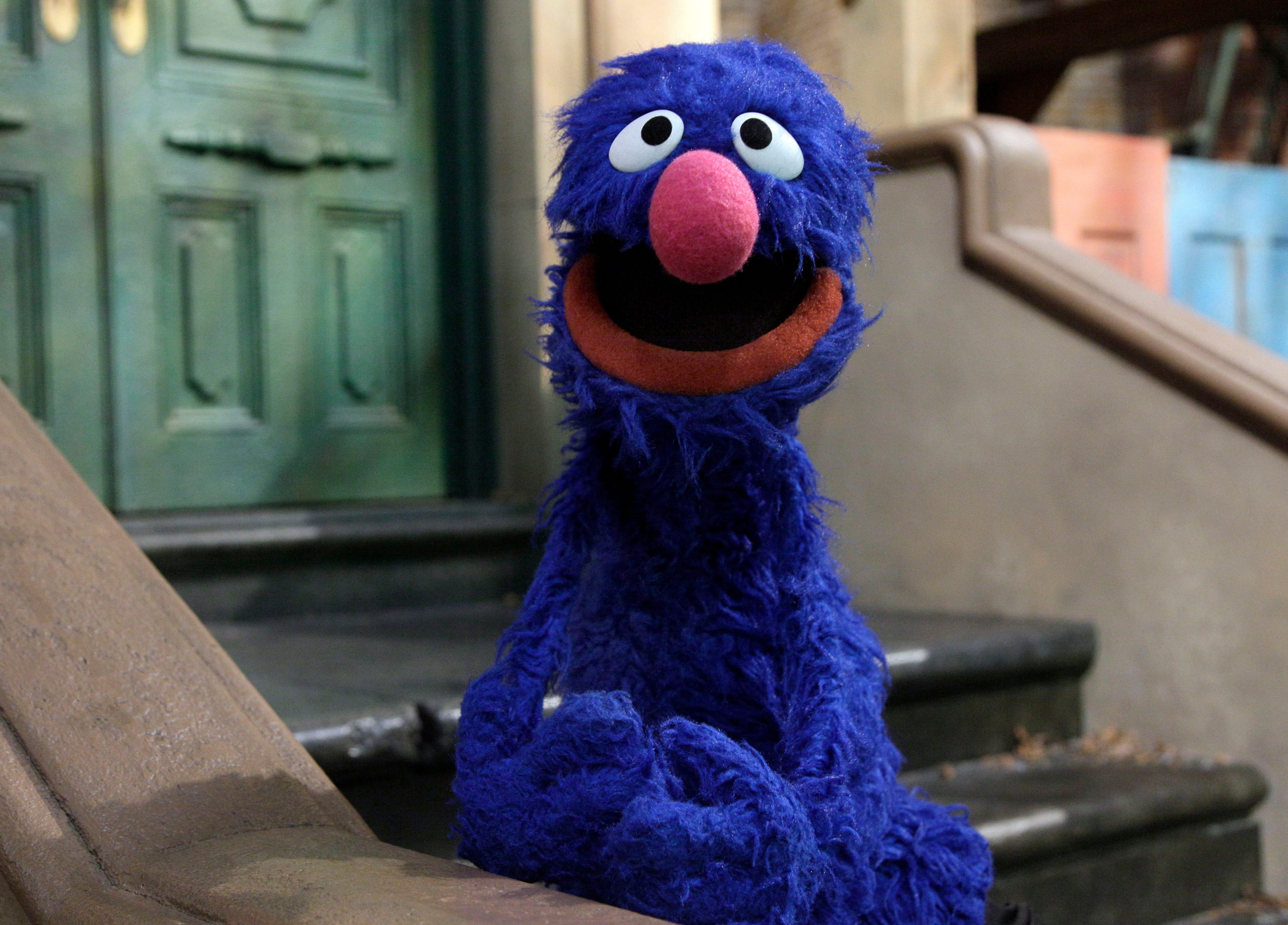 Mandatory Credit: Photo by Richard Drew/AP/Shutterstock (6287109a) Grover Grover is posed on the set of "Sesame Street," in New York. Earning money is one of the financial fundamentals that is part of "For Me, For You, For Later," a new project featuring Grover, Elmo, Cookie Monster and their Muppet pals Family Finance Sesame Street, New York, USA