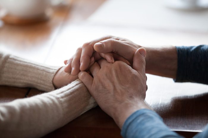 Old middle aged people holding hands close up view, senior retired family couple express care as psychological support concept, trust in happy marriage, empathy hope understanding love for many years