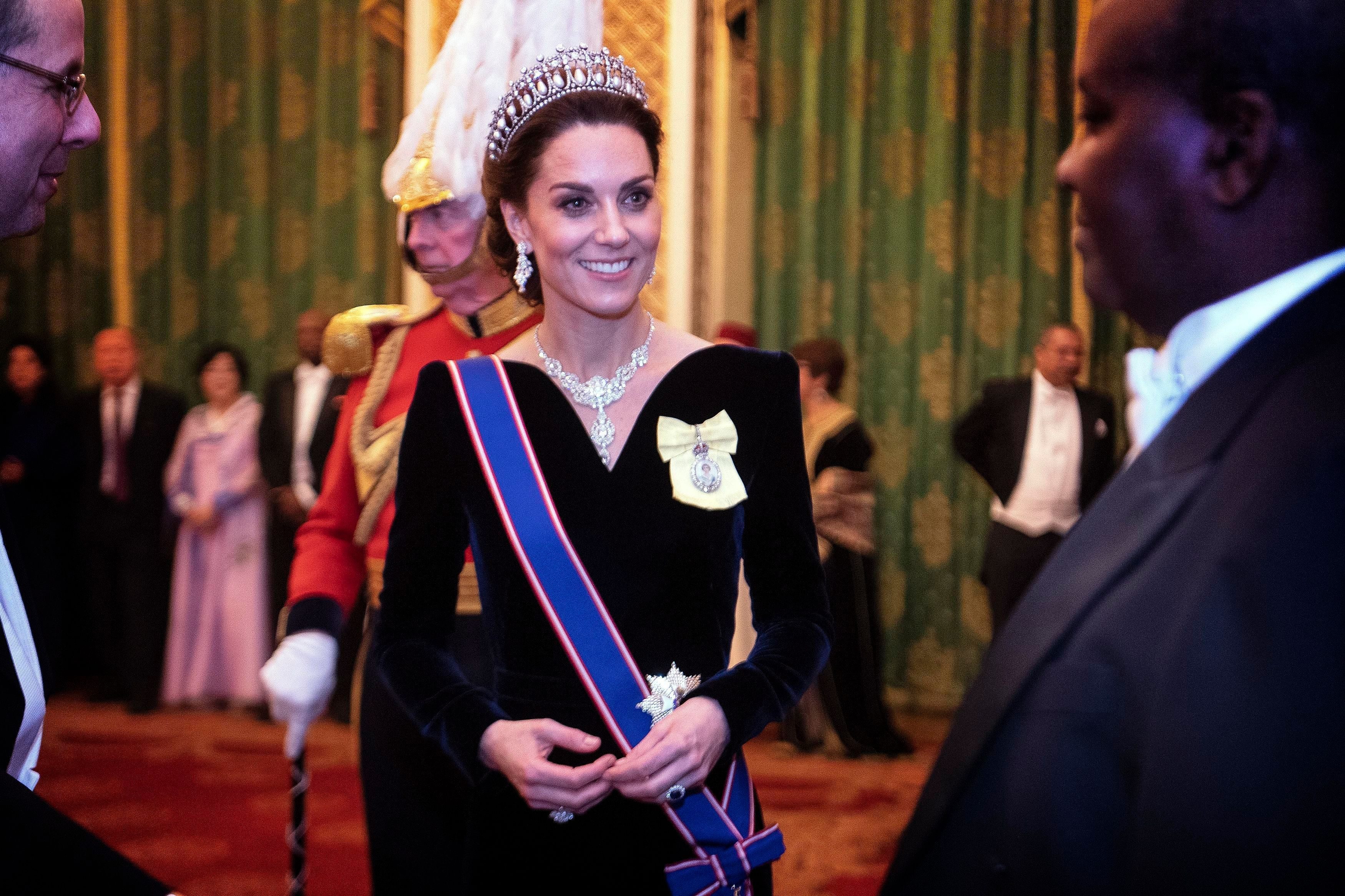 Mandatory Credit: Photo by Shutterstock (10502289j) Catherine Duchess of Cambridge talks to guests at an evening reception for members of the Diplomatic Corps at Buckingham Palace Diplomatic reception, Buckingham Palace, London, UK - 11 Dec 2019