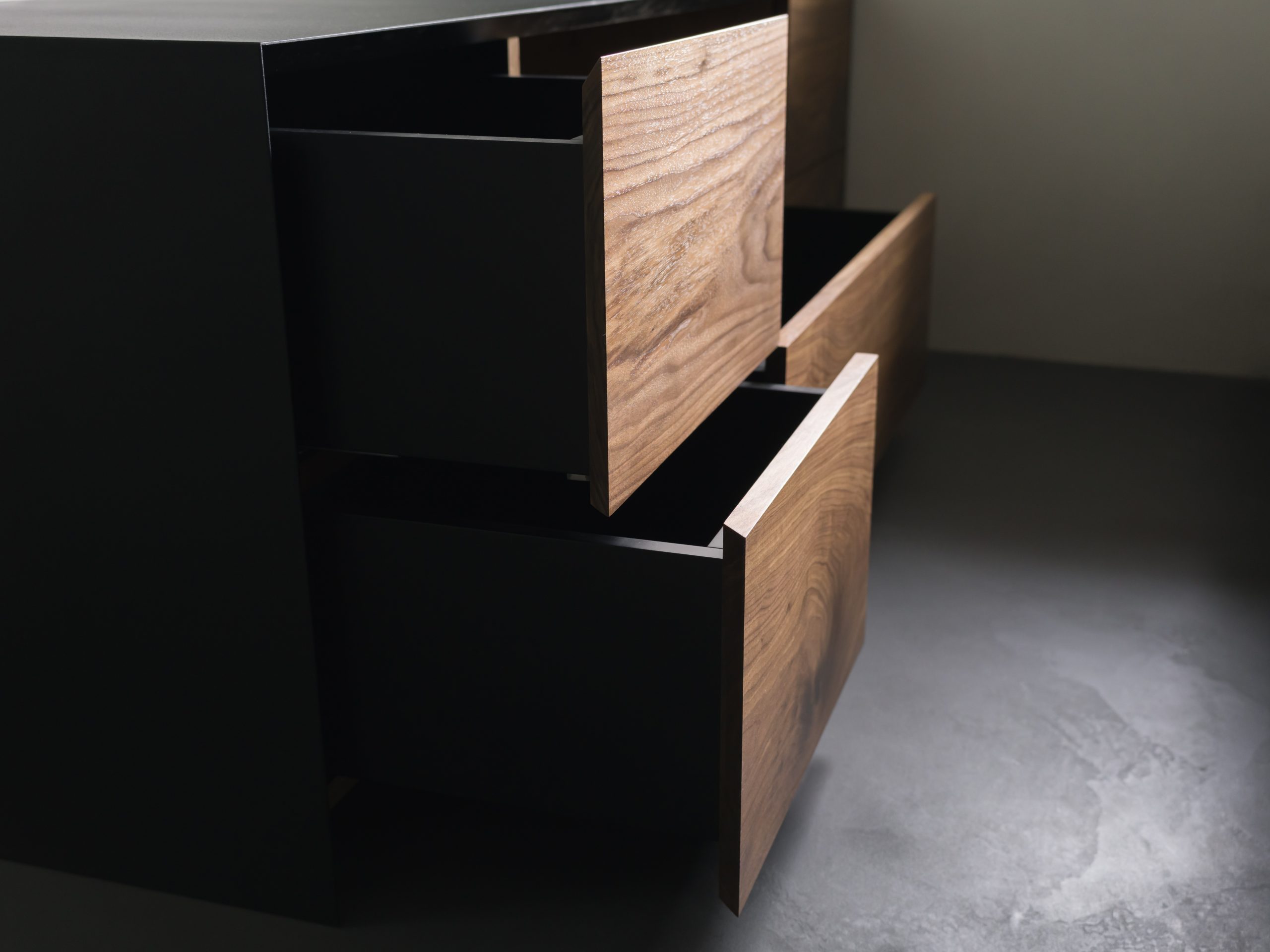 Closeup details of modern tv stand made from walnut and powder coated steed