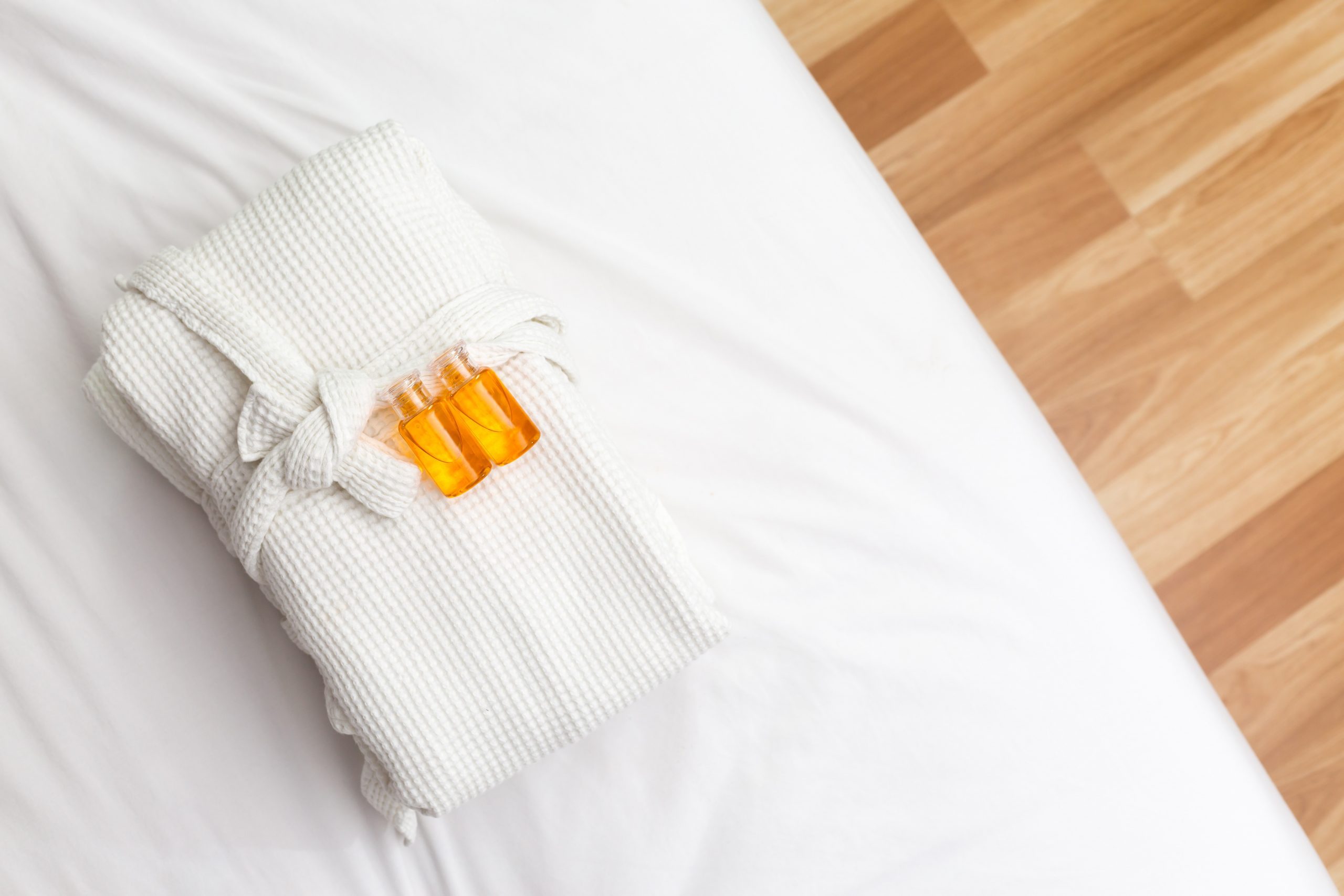 Liquid soap put on bathrobe in room.