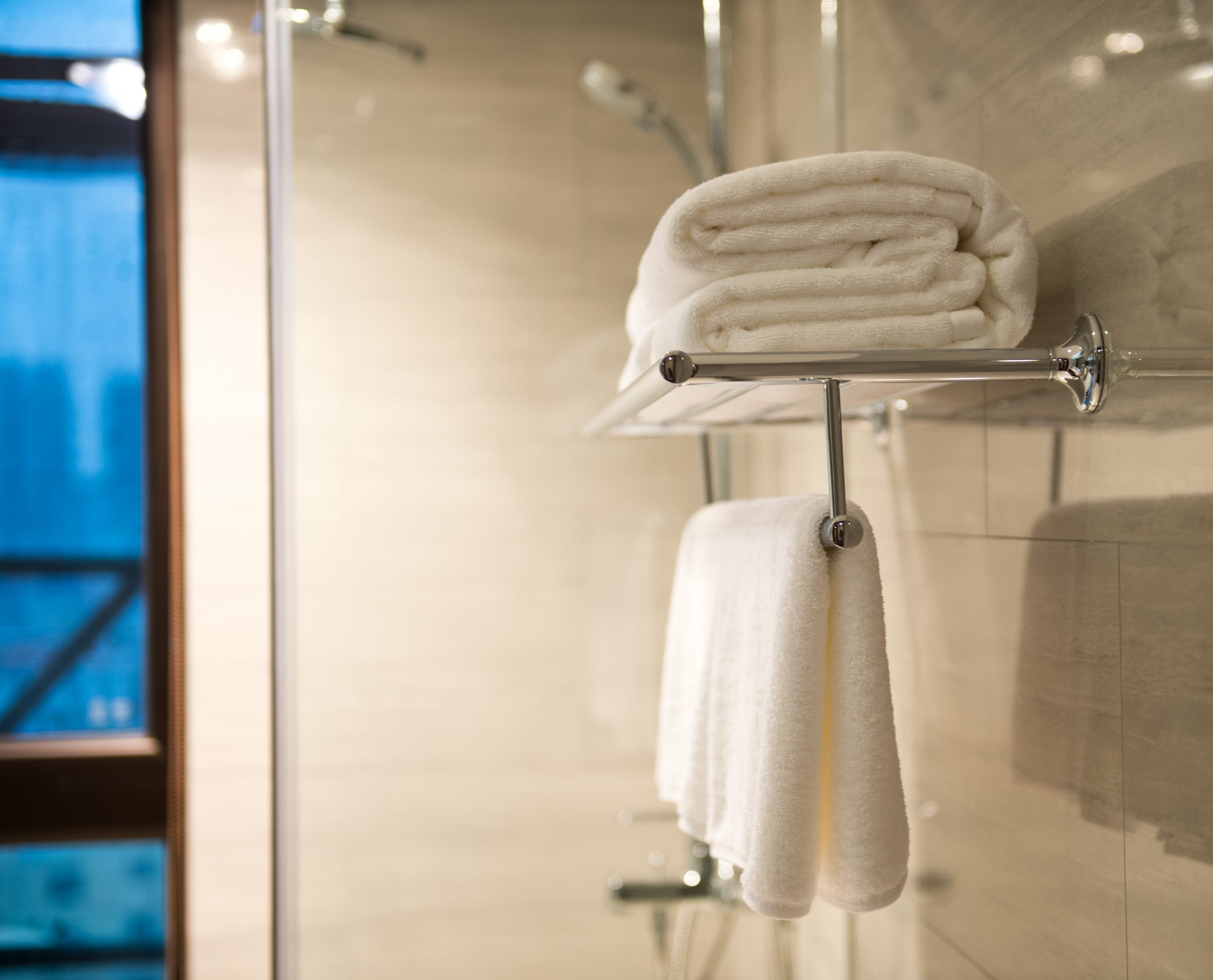 Clean white towel on a hanger prepared to use.