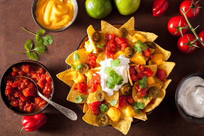 nachos loaded with salsa, cheese and jalapeno