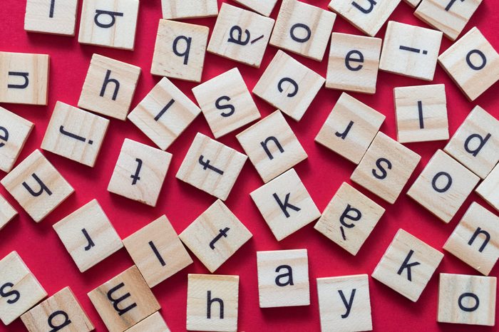 Alphabet letters on wooden scrabble pieces, from above