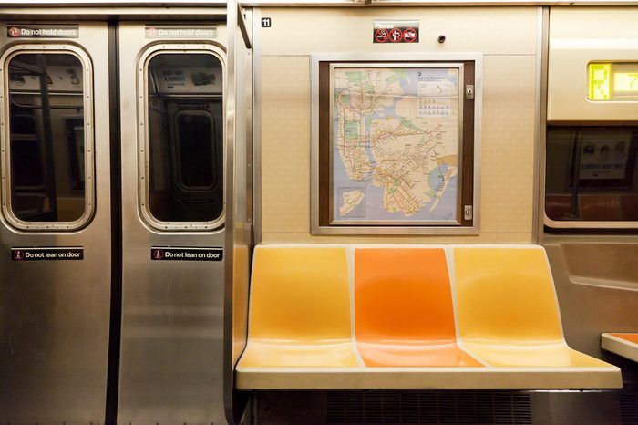 New York, NY, USA - March 11, 2016: Inside of subway wagon: Colorful seats and inside of empty car: The NYC Subway is one of the oldest and most extensive public transportation systems in the world.