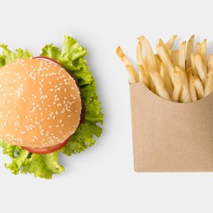 Concept of mock up burger and french fries on white background. Copy space for text and logo. Clipping Path included on white background.