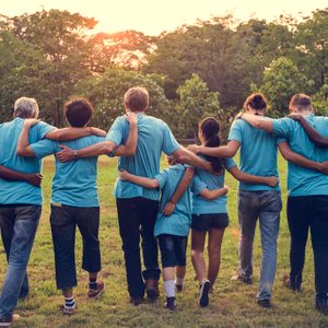 Group of diversity people volunteer arm around