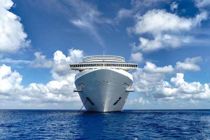 Cruise ship in crystal blue water with blue sky