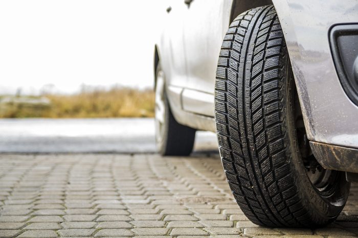 Close-up image of car wheel with black rubber tire