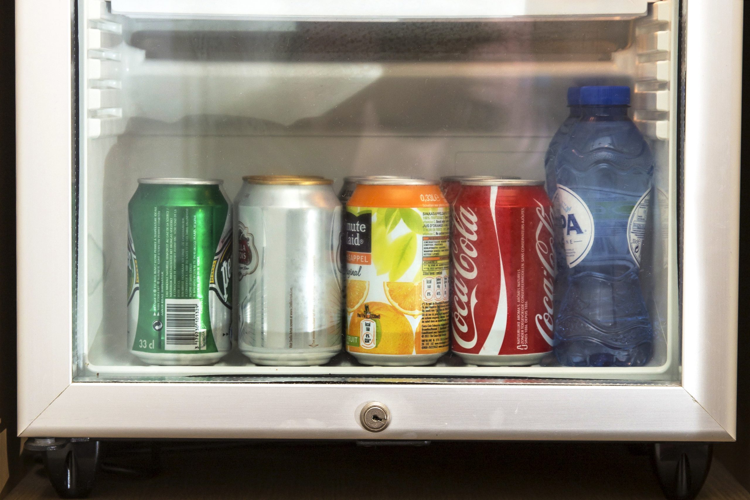 Mandatory Credit: Photo by Jochen Tack/imageBROKER/Shutterstock (4799216a) Mini bar with drinks and a safe for valuables in a hotel room VARIOUS