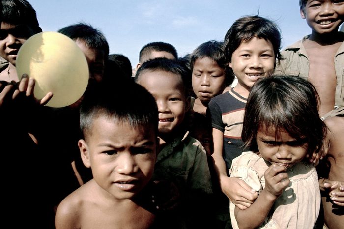 Cambodian refugees at Wat Nhu Lai (temple) on route 5, just north of Phnom Penh on . Soup kitchen there is administered by Catholic relief services 7 Mar 1975