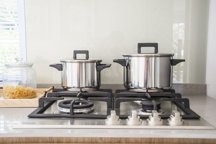 Pot on the gas Stove and Cooking in Kitchen