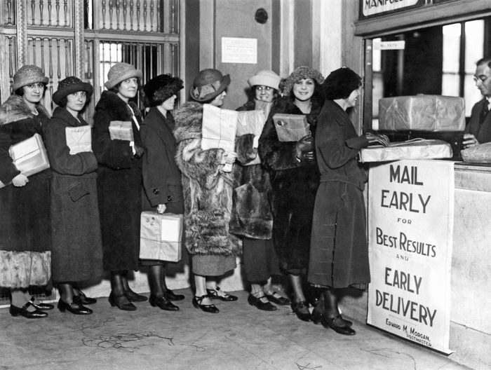 Mandatory Credit: Photo by Underwood Archives/UIG/Shutterstock (3837410a) New York, New York: c. 1923. These women have already bought all their presents and are mailing them early, just like the sign says. VARIOUS