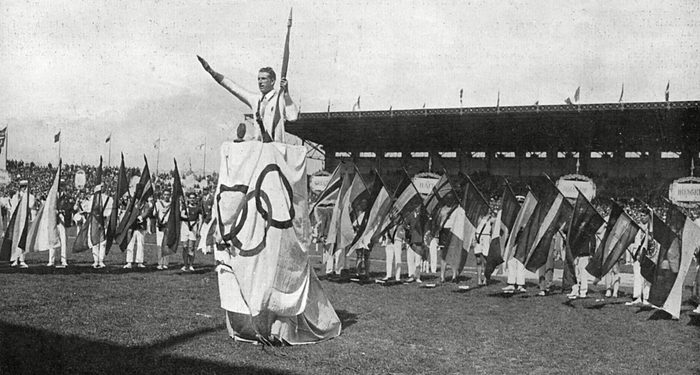 Mandatory Credit: Photo by Historia/Shutterstock (7665077dj) Surrounded by the Flags of All Forty-five Nations Taking Part in the 1924 Paris Olympic Games George Andre the Famous French Athlete Takes the Oath of Loyalty On Behalf of All Competitors 1924 Historical Collection 177
