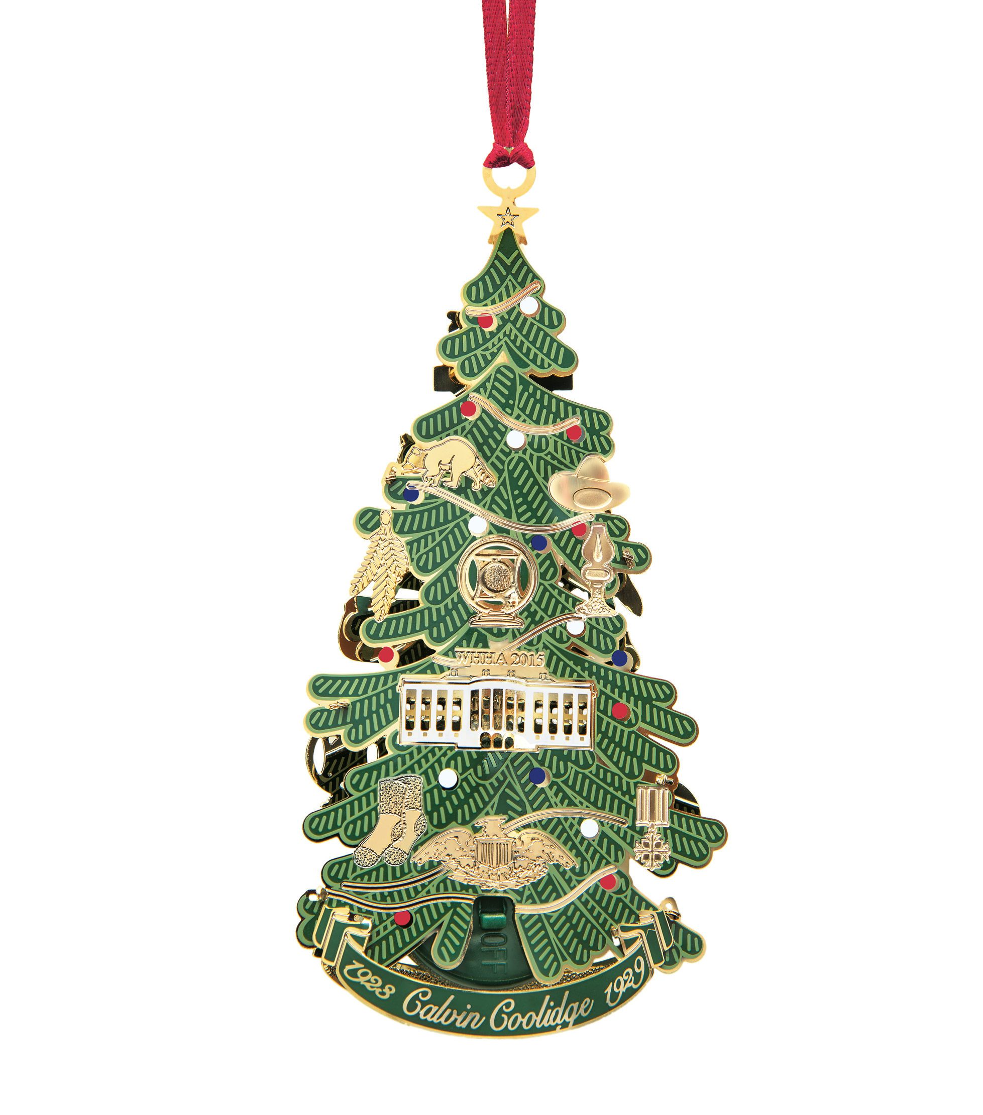 This image is the Back view (with string) of the 2015 White House Christmas Ornament that honors the administration of Calvin Coolidge, who served as the 30th President of the United States from 1923 to 1929. A depiction of the first National Christmas tree, it features ornaments representing the events of Coolidge's life and presidency. On Christmas Eve in 1923 President Coolidge lit strings of more than 2,500 electric bulbs on the first National Christmas Tree, an annual tradition that continues to this day. In honor of this, the ornament illuminates from a light inside the tree.