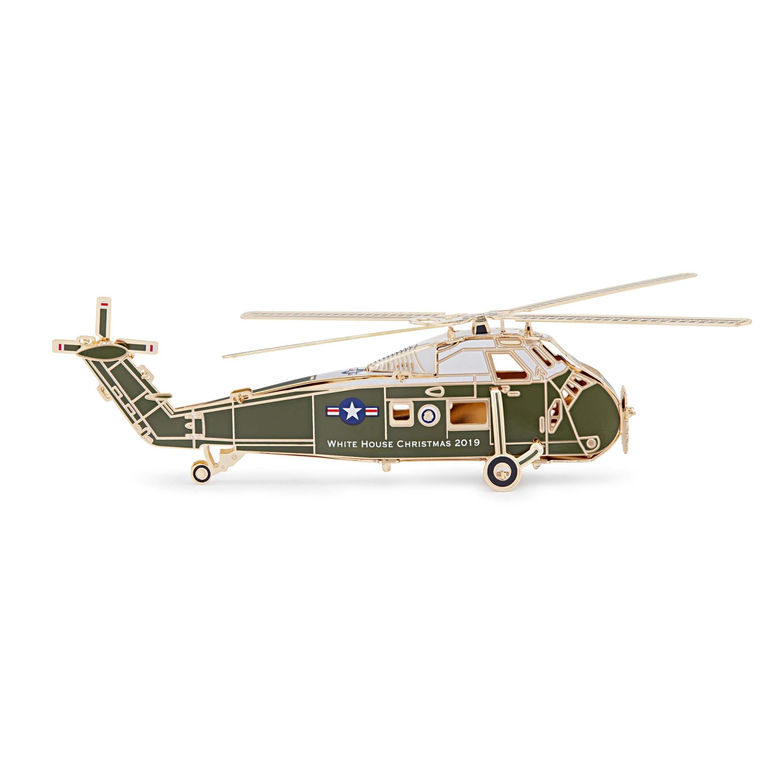 The White House Historical Associations 2019 Official White House Christmas Ornament honors Dwight D. Eisenhower, 34th president of the United States. The design of the 2019 ornament follows President Eisenhowers example of fairness: as the first president to regularly use a helicopter, he had two Executive Flight Detachments for his transport provided by flight crews of the United States Army and the United States Marine Corps. To demonstrate his impartiality, Eisenhower alternated between these helicopters and their respective military personnel. Likewise the 2019 ornament does not represent a single branch of the military. One side features the Presidential Seal, representing Eisenhowers two terms as commander in chief of the Armed Forces. On the other is his five-star rank, honoring his military service as a general in the United States Army. The 39th Official White House Christmas Ornament is American-made by a veteran-owned company and continues the tradition of honoring U.S. presidents in sequential order. The sale of every ornament supports the Associations mission to preserve, protect, and provide public access to the White House and educate the public on its history.