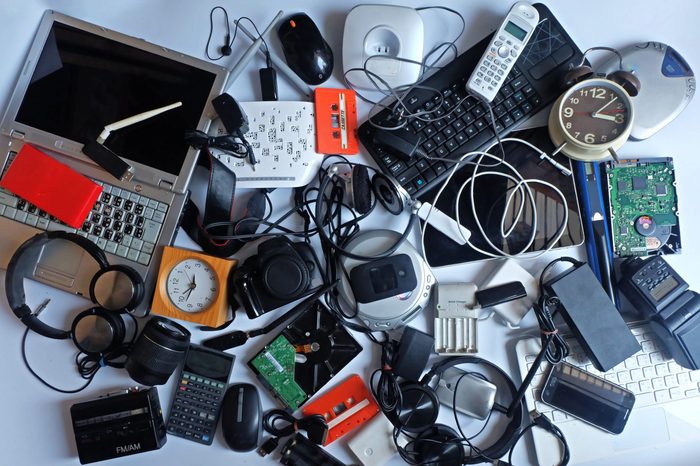 Pile of used Electronic Waste on white background, Reuse and Recycle concept, Top view 