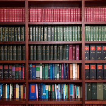 A bookshelf containing volumes of books