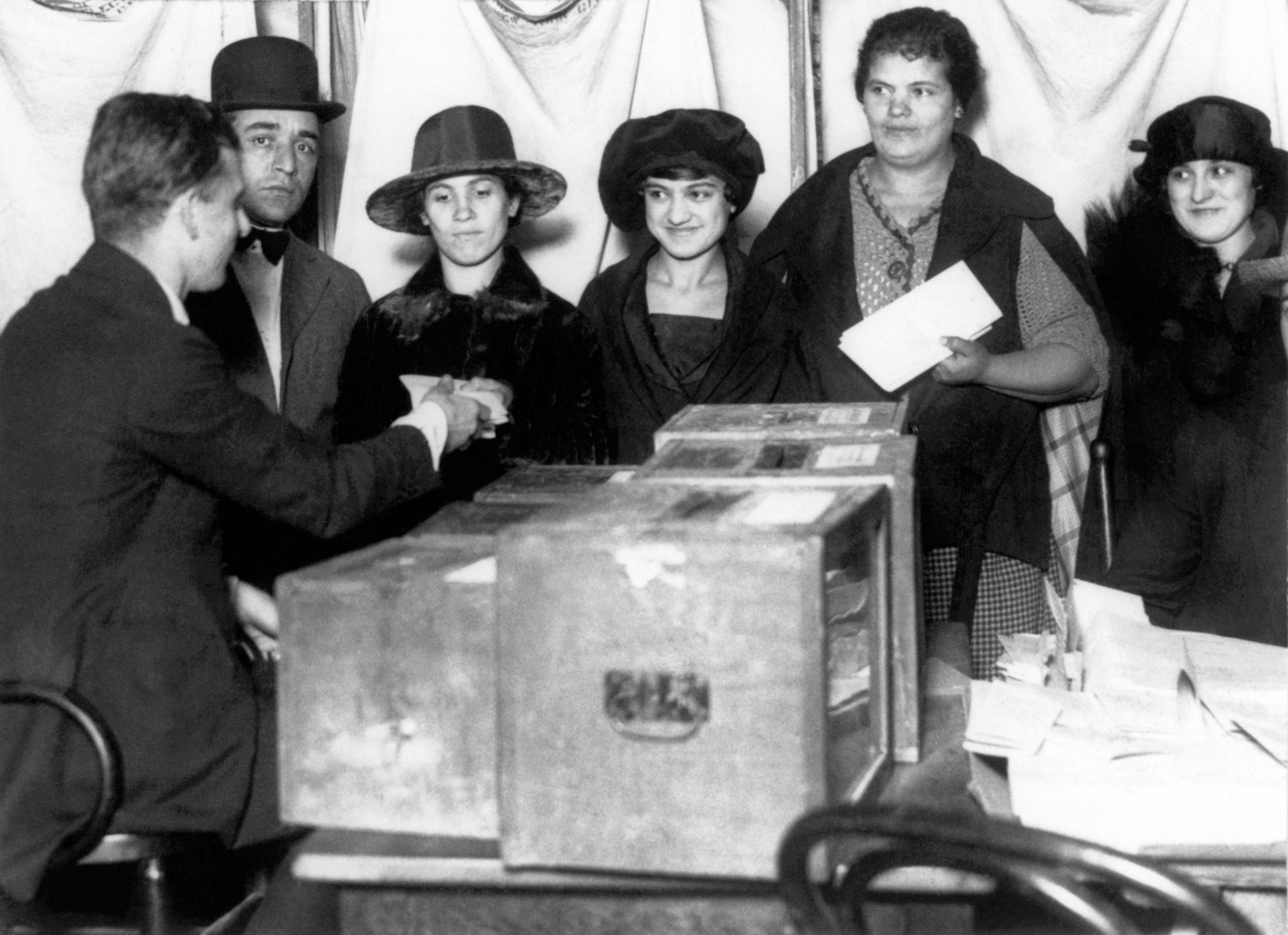 women standing in line to vote