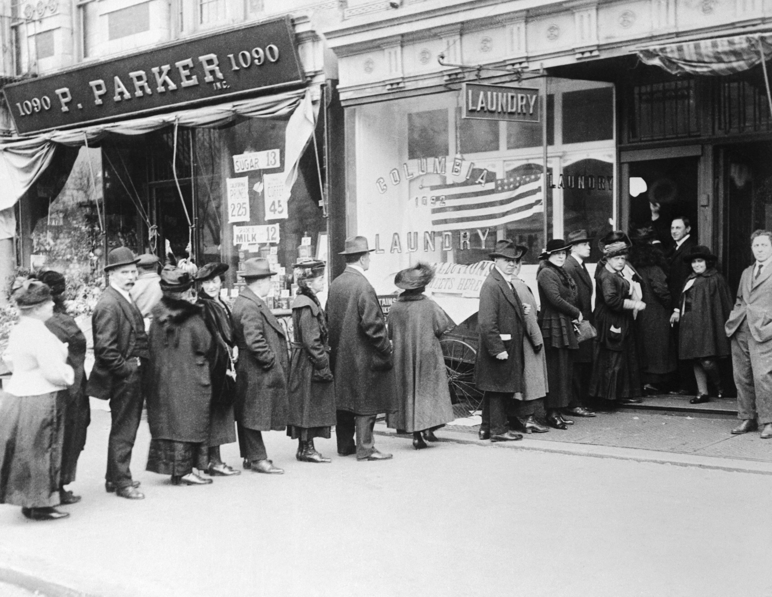 women standing in line to vote