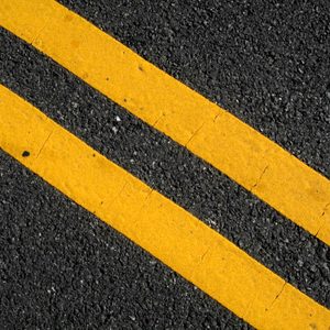 Double yellow lines on street.
