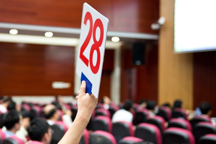 Holding a auction paddle