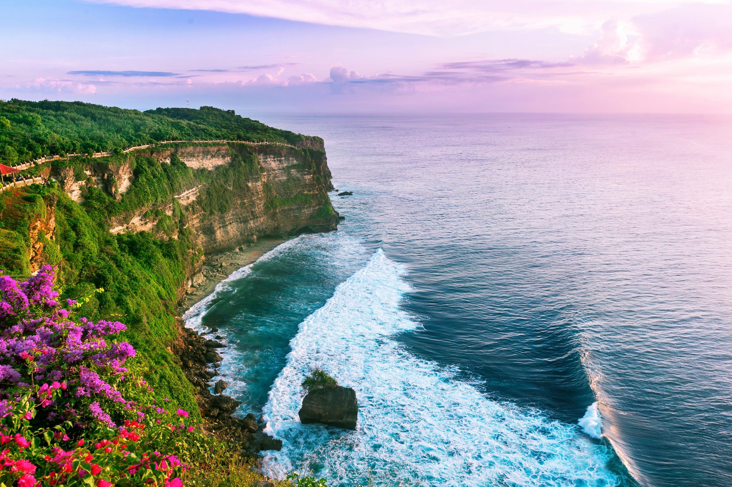 View of Uluwatu cliff with pavilion and blue sea in Bali, Indonesia