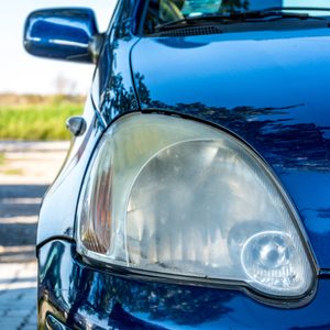 Front headlight unpolished cloudy foggy of old car