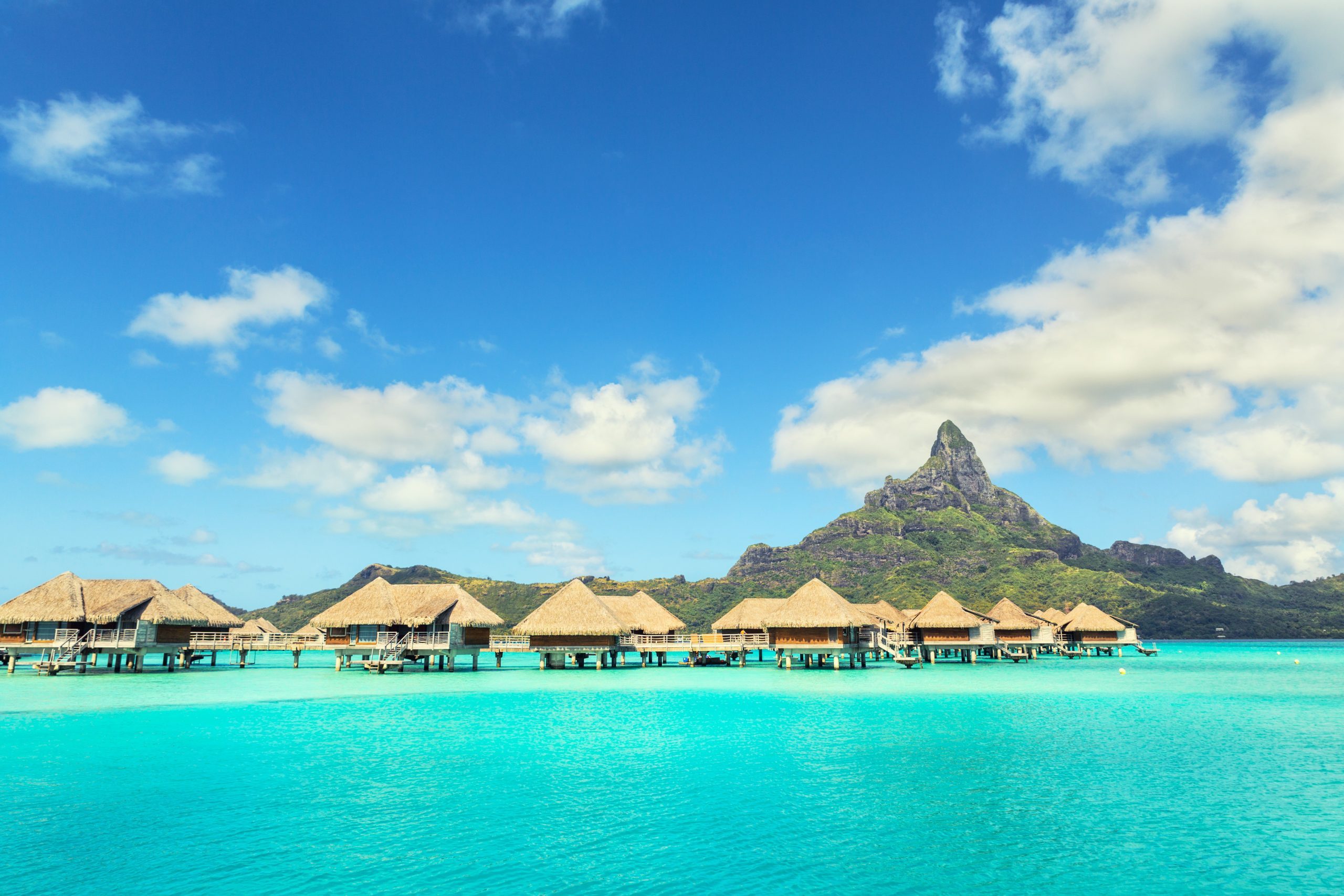 Otemanu mountain and luxury bungalow at Bora Bora island, Tahiti, French Polynesia