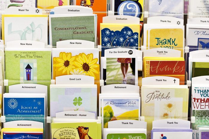 Assorted greeting cards in a shelf for sale in a local supermarket