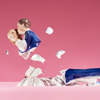 wedding statue smashed on pink background