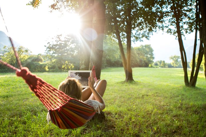 woman on hammock ipad